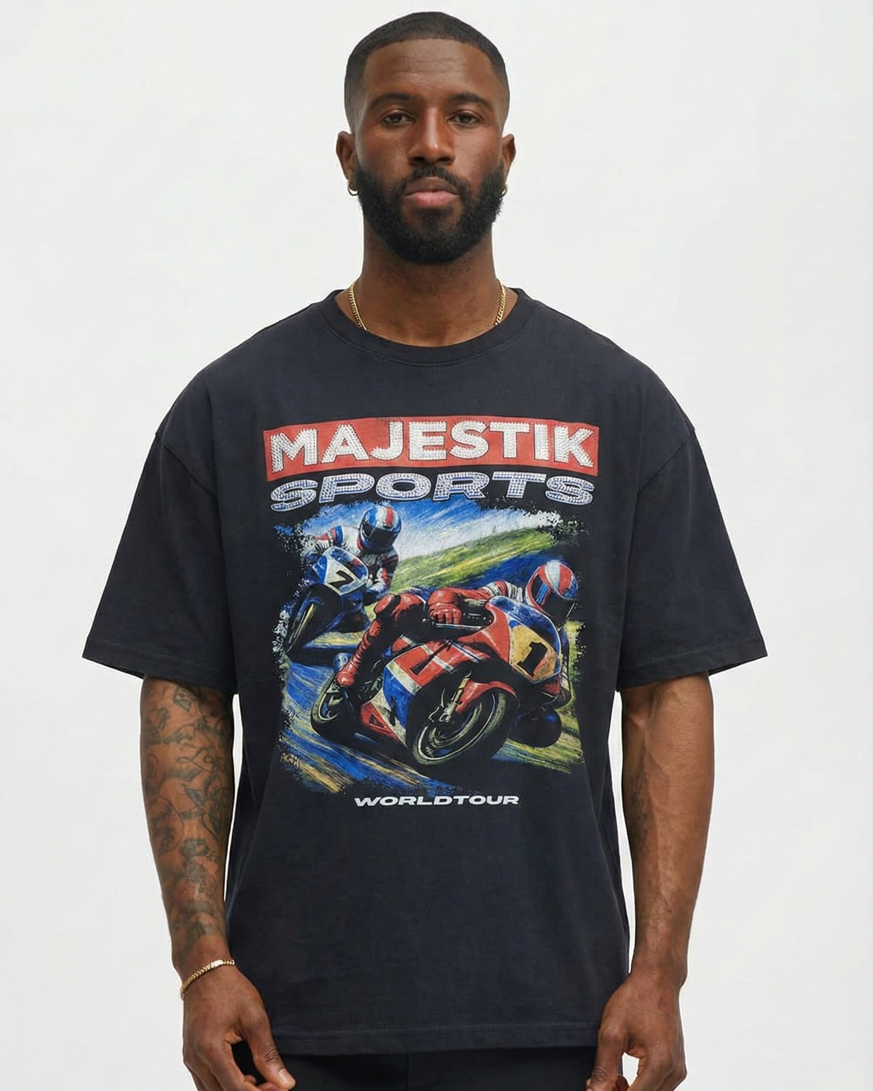 Man wearing a black t-shirt with 'Majestik Sports Worldtour' graphic on a white background