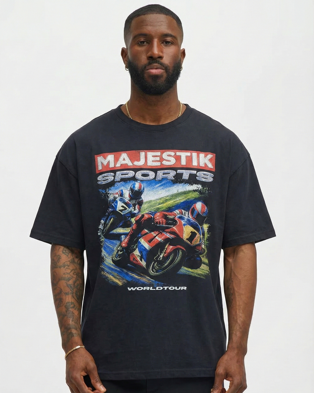 Man wearing a black t-shirt with 'Majestik Sports Worldtour' graphic on a white background